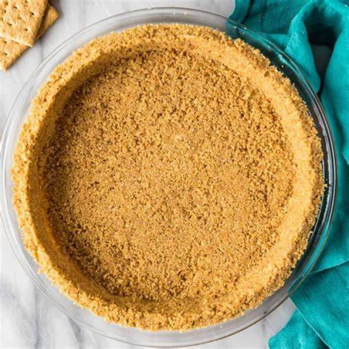 Graham cracker crust in a pie plate.